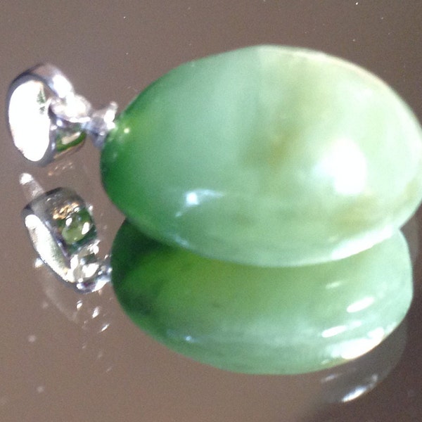 Hand Carved Chatoyant B.C. Nephrite Jade Pendant. Sterling Silver bail.