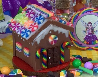 Rainbow Gingerbread House, Rainbow Candies, Wood Circle, Assorted Candy, Rainbow Candy Canes, Gumballs, Gingerbread, Red, Yellow, Green,