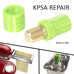 May include: Green plastic repair part for a KitchenAid pasta attachment. The part is labeled "KPSA REPAIR" and "Made in USA".