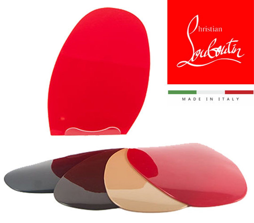 French footwear designer Christian Louboutin poses on the red