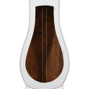May include: White grandfather clock with a wooden interior and a gold chain hanging down the centre.