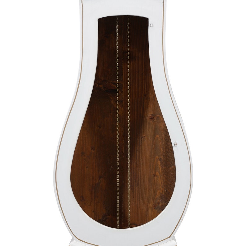 May include: White grandfather clock with a wooden interior and a gold chain hanging down the centre.