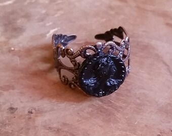 Creation - Copper filigree Art Nouveau ring with a round portrait of a woman in black pressed glass