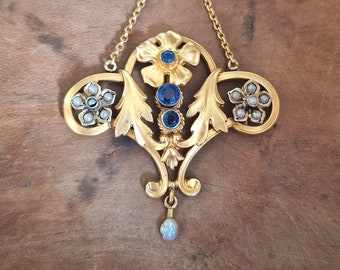 Art Nouveau gold-plated pendant in the shape of foliage and flowers with blue stones and fine pearls