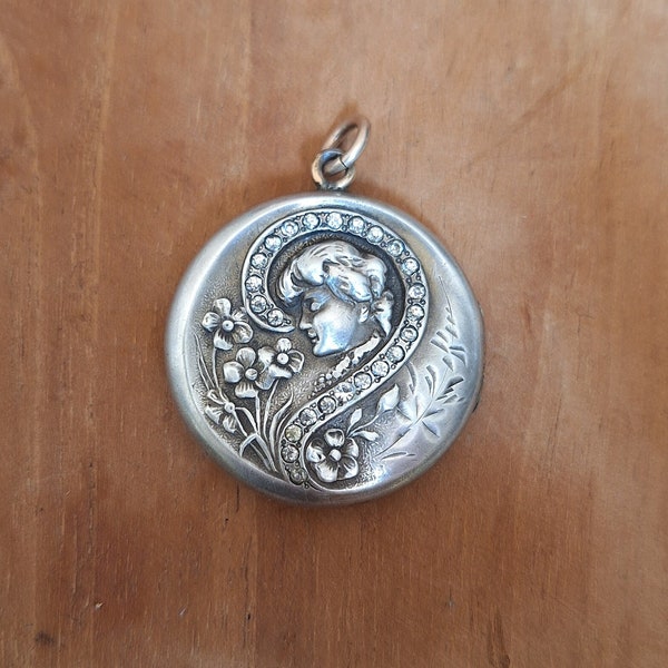 Art Nouveau round photo holder medallion pendant with portrait of a woman and flowers in silver? with white stones and gold plated