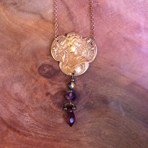 Creation - Art Nouveau copper necklace depicting a lady smelling a rose with faceted purple beads