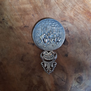 Old Danish hand mirror in silver metal with country scene