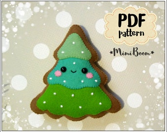 May include: A felt Christmas tree ornament with a brown gingerbread base, green and blue felt layers, white felt dots, and a cute smiling face. The ornament is on a white background with a blurry white and gray pattern.
