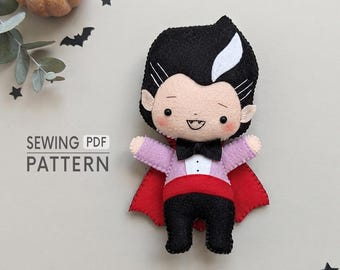 May include: A felt vampire doll featuring black hair with a white streak, a black bowtie, a white shirt front, a red cape, and black trousers. The text SEWING PDF PATTERN is visible on the left side of the doll, accompanied by small pumpkin, bat, and star icons.