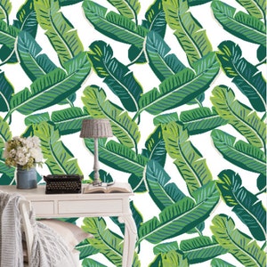 May include: A white background with a repeating pattern of green banana leaves. The leaves are stylized and have a graphic design.
