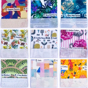 May include: Nine fabric swatches with different patterns and textures. The swatches are labeled with the names of the fabrics, including "Organic Panama", "Recycled Eco Ly", "Eco rPet Canvas", "Cuddle Fleece", "Melino Cotton", "3 Pass Blackout", "Satin", ".c Cotton", and "Or Int."