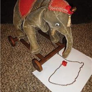 1910 stuffed elephant on wheels