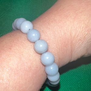 Angelite Bracelet, 8 mm round beads, Stretchy; Measure approximately 7.5 inches around.