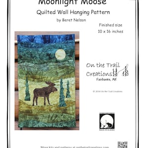 May include: A quilted wall hanging pattern featuring a moose silhouetted against a moonlit forest scene. The pattern is titled "Moonlight Moose" and is by Beret Nelson. The finished size is 10 x 16 inches.