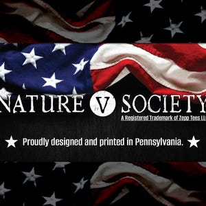 May include: A black and white graphic design with the text "NATURE V SOCIETY" and the words "A Registered Trademark of Zepp Tees LLC" and "Proudly designed and printed in Pennsylvania." The graphic is set against a backdrop of a red, white, and blue American flag.