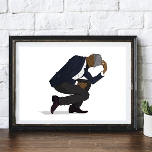 May include: A man in a blue suit and a gray hat is crouching down with his head in his hands.