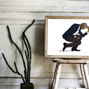 May include: A framed illustration of a person wearing a blue suit and a gray hat, crouching with their head down.