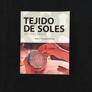 May include: A book titled "TEJIDO DE SOLES LECCIONES BÁSICAS" by Sandra I. Rodríguez Martínez. The cover features a light green geometric pattern and a photo of hands working with thread on a round object. The background is black.