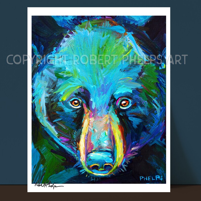 May include: A close-up painting of a black bear's face. The bear's fur is painted in shades of blue, green, and purple. The bear's eyes are brown and the nose is pink. The painting is signed "Robert Phelps" in the bottom left corner and "PHELPS" in the bottom right corner.