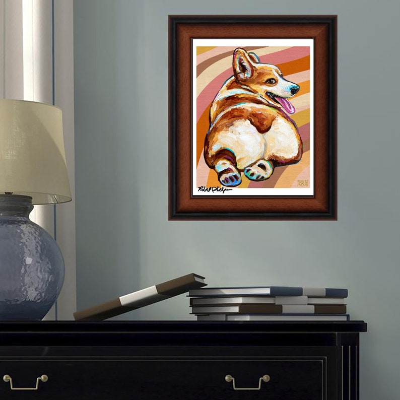 May include: A painting of a corgi dog with a brown and white coat, sitting with its back to the viewer. The dog is on a background of orange and brown stripes. The painting is framed in a brown wood frame.