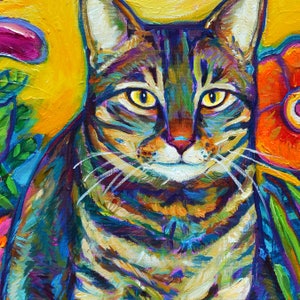 May include: A close-up portrait of a tabby cat with green eyes. The cat is painted in a vibrant, colorful style with shades of blue, green, yellow, orange, and purple. The cat is looking directly at the viewer with a serious expression.