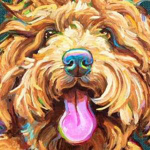 May include: A close-up painting of a brown and gold dog with a pink tongue sticking out. The dog's fur is painted in a loose, expressive style, with highlights of blue and green. The dog's eyes are brown and the nose is black.