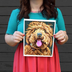 May include: A painting of a brown and white dog with a pink tongue sticking out. The dog is painted in a stylized, almost abstract way, with thick brushstrokes and bright colors. The background is a dark teal.