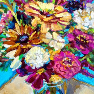May include: A close-up of a bouquet of colorful flowers in a vase. The flowers are a mix of pink, purple, white, yellow, and orange. The vase is a clear glass with a blue and green pattern.