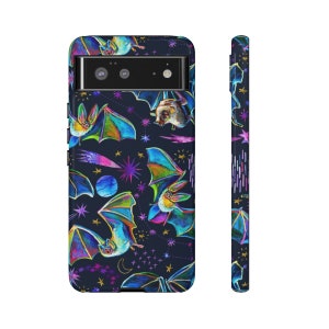May include: A phone case with a dark blue background and a colourful pattern of bats and stars. The case has a cutout for the camera lens.
