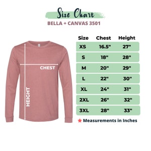 May include: A long-sleeved, mauve-colored shirt with a size chart. The chart lists chest and height measurements in inches for sizes XS to 3XL. The text "Size Chart" is at the top.