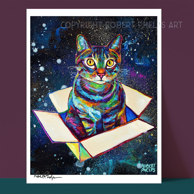 May include: A colorful painting of a tabby cat sitting inside a box floating in space. The cat has yellow eyes and is looking directly at the viewer. The background is a dark blue with white stars and a galaxy of colors.