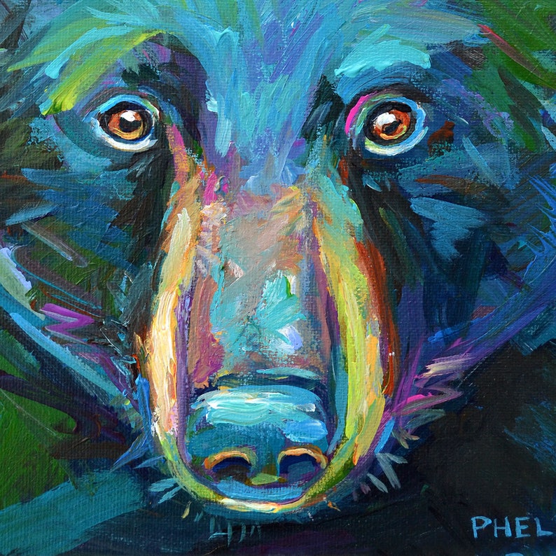 May include: Close-up painting of a black bear's face. The bear's fur is painted in shades of blue, green, and purple. The bear's nose is a bright yellow and the eyes are orange. The painting is signed "PHEL" in the bottom right corner.