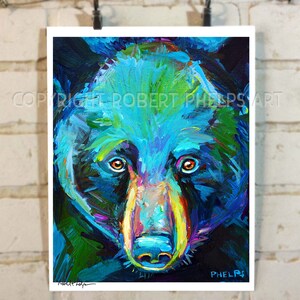 May include: A close-up painting of a black bear's face. The bear's fur is painted in shades of blue, green, and purple. The bear's eyes are orange, and its nose is pink. The painting is signed "Robert Phelps" in the bottom right corner.