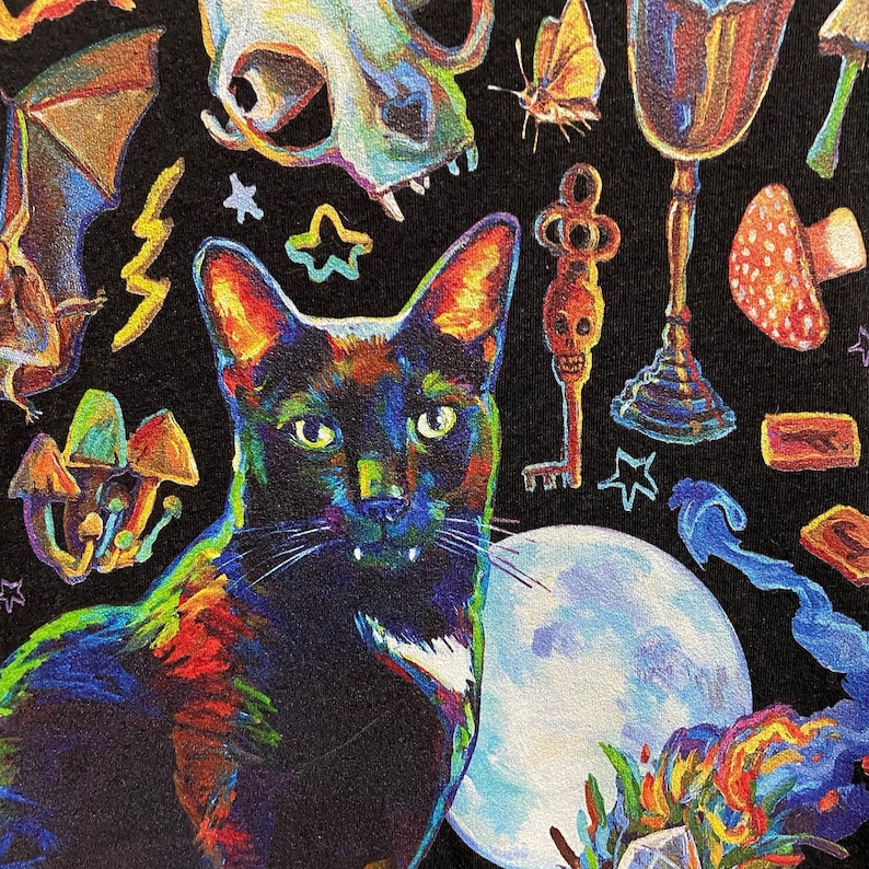 May include: A black cat with green eyes and white markings on its chest sits in front of a full moon. The background is a dark, abstract design with a skull, a key, a goblet, and mushrooms.