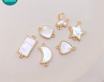 May include: Six gold-toned metal charms with white shell inlays. The charms are shaped like a star, butterfly, crescent moon, rectangle, square, and triangle.
