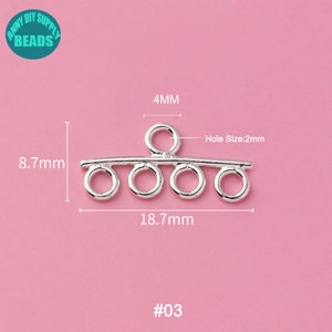 May include: Silver-toned metal connector with five loops, measuring 18.7 mm wide and 8.7 mm tall. The connector has a 4 mm loop at the top and a hole size of 2 mm. #03