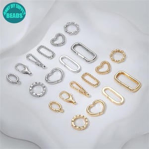 May include: Assortment of silver and gold metal jewelry findings, including heart, circle, and oval shapes.  The findings are perfect for making necklaces, bracelets, and earrings.
