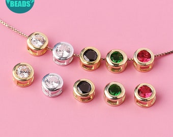 May include: A set of 10 round, gold-tone and silver-tone bead caps with clear, black, green, and red gemstones. The bead caps are designed for jewelry making.