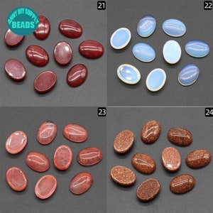 May include: Assortment of oval-shaped cabochons in various colors, including red, pink, brown, and white. The cabochons are arranged in four groups, labeled 21, 22, 23, and 24.