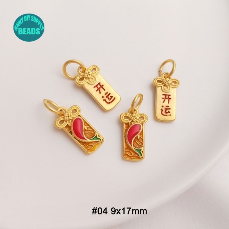 May include: Four gold-colored charms with a loop for hanging. Two charms have a red and green design, and two have Chinese characters. The charms are rectangular, with a decorative knot at the top. The size is 9x17mm.