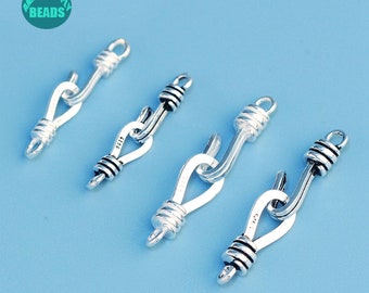 May include: Four silver-toned metal clasps with a twisted rope design. Each clasp has a hook on one end and a loop on the other end.