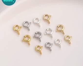 May include: Assortment of gold, silver, and brass lobster clasps for jewelry making. These clasps are perfect for necklaces, bracelets, and other jewelry projects.