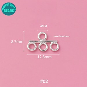 May include: Silver-toned metal connector with four loops. The connector measures 12.8 mm wide, 8.7 mm high, and has a 4 mm loop at the top. The hole size is 2 mm. #02