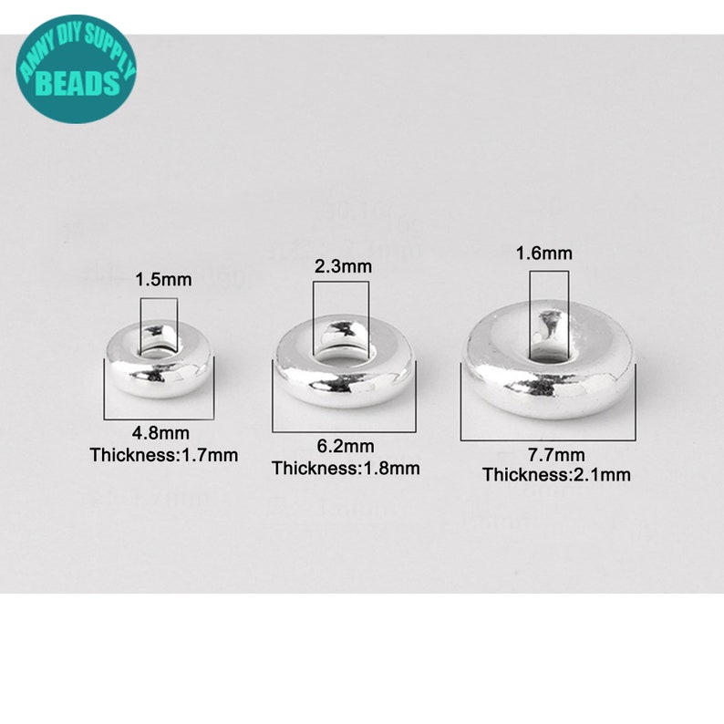 May include: Three silver jump rings in different sizes. The smallest ring is 1.5 mm in diameter and 4.8 mm in width, with a thickness of 1.7 mm. The middle ring is 2.3 mm in diameter and 6.2 mm in width, with a thickness of 1.8 mm. The largest ring is 1.6 mm in diameter and 7.7 mm in width, with a thickness of 2.1 mm.