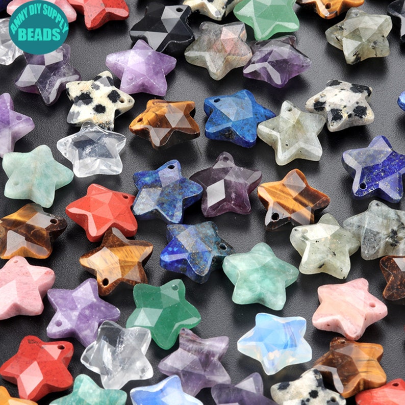 May include: Assortment of star-shaped gemstone beads in various colours, including red, green, blue, purple, and brown. The beads have a faceted design and a hole for stringing.