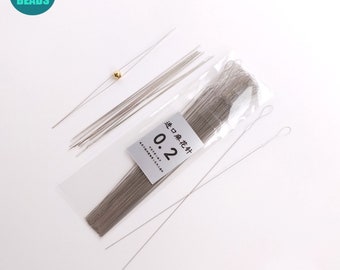 May include: A package of 50 silver-colored, 0.2 mm wire for jewelry making. The package includes a label with the text "0.2  进口  珠花针" in black.