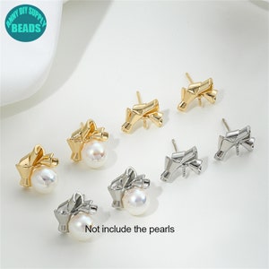 May include: Six gold and silver bow-shaped earring findings with a pearl attached to each bow. The text "Not include the pearls" is written below the earrings.