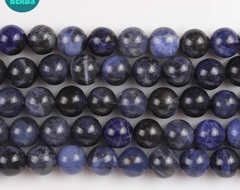 May include: A strand of round, dark blue gemstone beads. The beads are smooth and polished, with a slight variation in color and pattern.