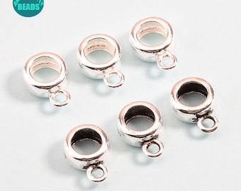 May include: Six silver-toned metal bead caps with a small loop on the bottom. The bead caps are designed to be used as a connector for jewelry making.