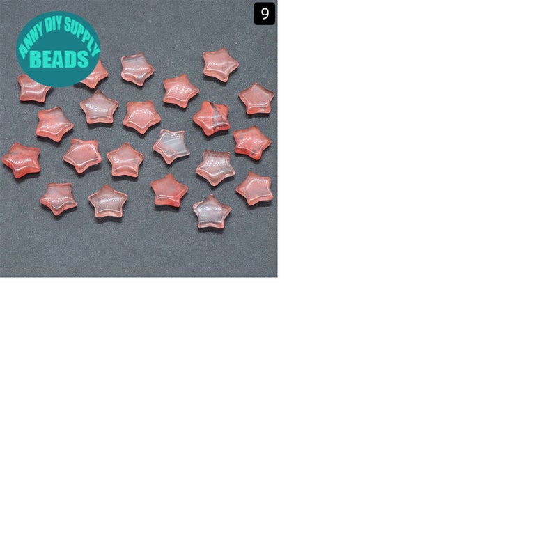 May include: Twenty pink star-shaped gemstone beads. The beads are translucent and have a slight shimmer. The beads are arranged in a loose cluster on a dark grey surface.